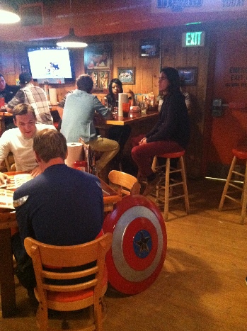 Captain America dining with an off duty Spiderman