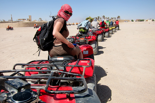 Emme Rogers and Audrey Scott quad biking through the desert outside of Hurghada, Egypt.